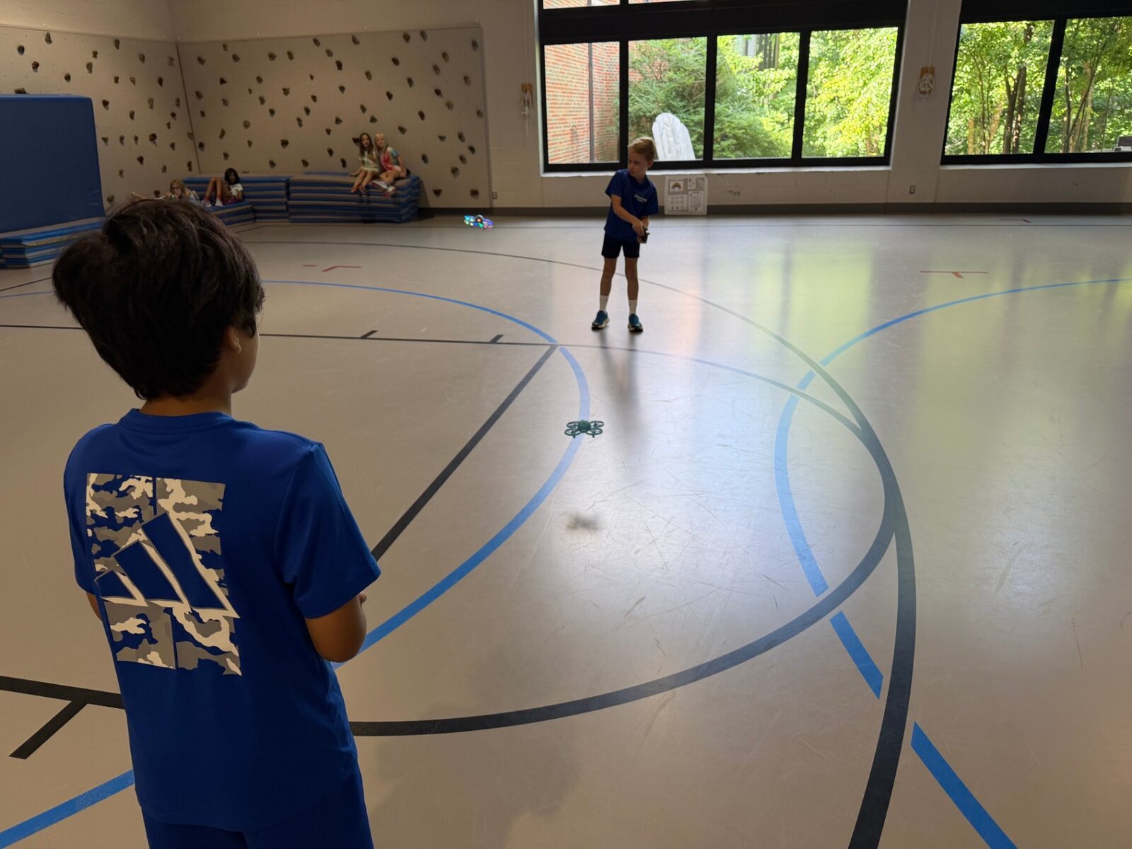 A child steering a drone in a Recreation Academy club